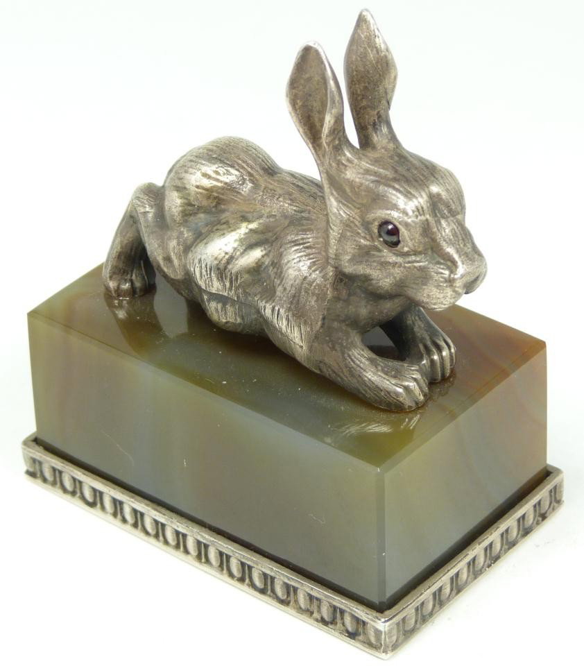 IMPERIAL RUSSIAN SILVER RABBIT FIGURE w AGATE BASE: Imperial Russian silver rabbit figure having cabochon cut pink sapphire eyes and set on agate rectangular base. Holds town marks and 84 silver purity marks. Also holds Julius Rappoport's "I.P." workma