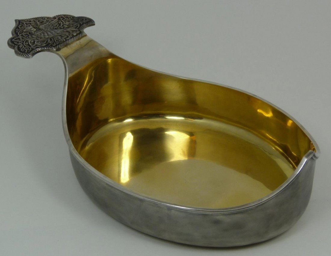 IMPERIAL RUSSIAN SILVER & ENAMEL KOVSH FABERGE: Imperial Russian silver kovsh. Has paddle handle with eagle having the king's head. Gold wash Interior. Bottom holds 84 silver purity and town marks. Holds Cyrillic Faberge marks to bottom. Measures 3