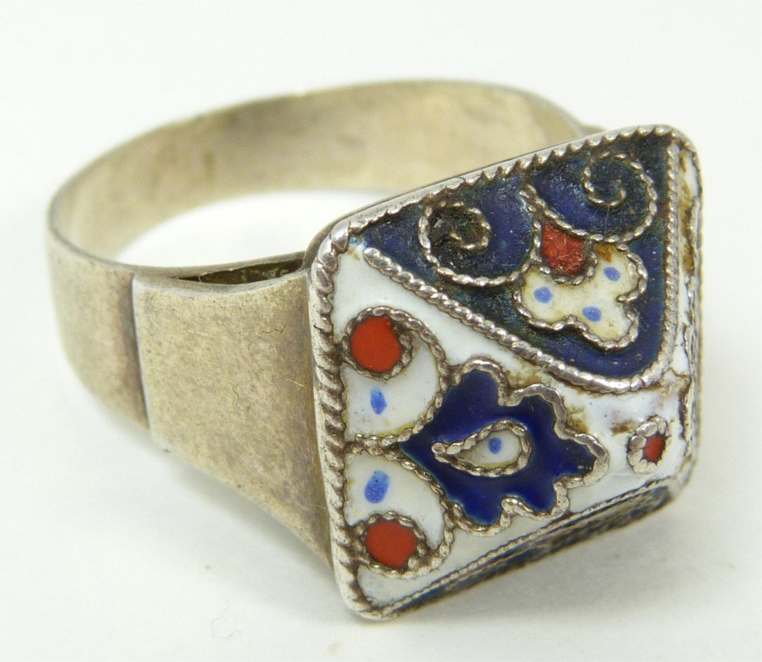 OLD SOVIET RUSSIAN ENAMELED 875 SILVER RING: Old Soviet Russia 875 silver ring. Has a blue white and red floral design with pyramid shape. Marks to bottom of ring. Ring size 10. Total weight of .26ozt.