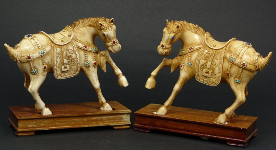 Pr FINE CHINESE CARVED IVORY JEWELED HORSES: Pair of antique Chinese hand carved ivory figures depicting horses with one hoof raised. Each is jeweled throughout with lapis lazuli, turquoise and red coral beads. 19th/20th century. Each measures a
