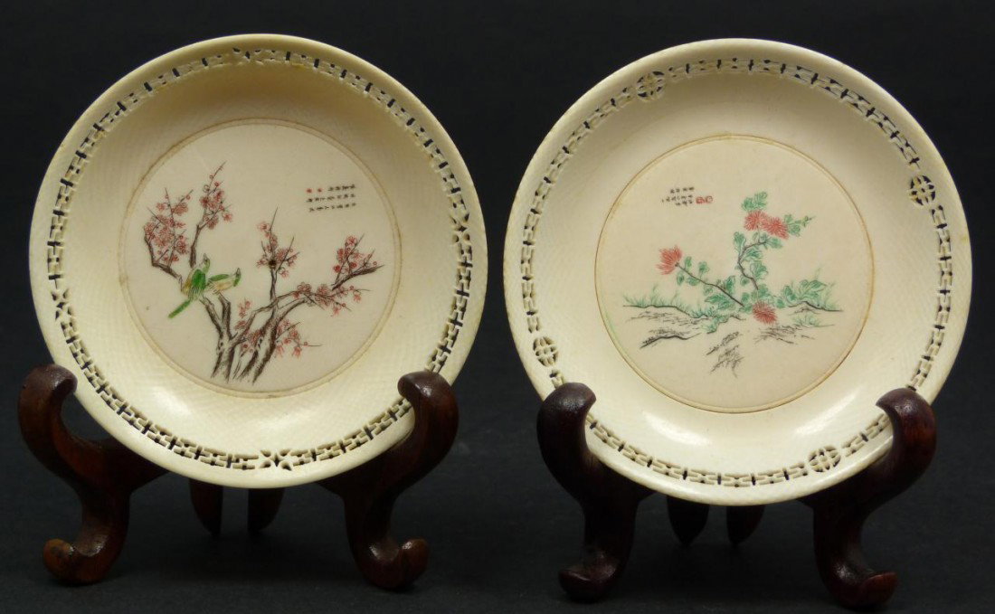 Pr OF EXQUISITE ANTIQUE CHINESE IVORY PLATES: Pair of exquisite antique Chinese polychromed ivory round plates. Each has a vivid polychromed etched design depicting flowers and birds. Each has a fine reticulated screen border decoration. 19th/20t