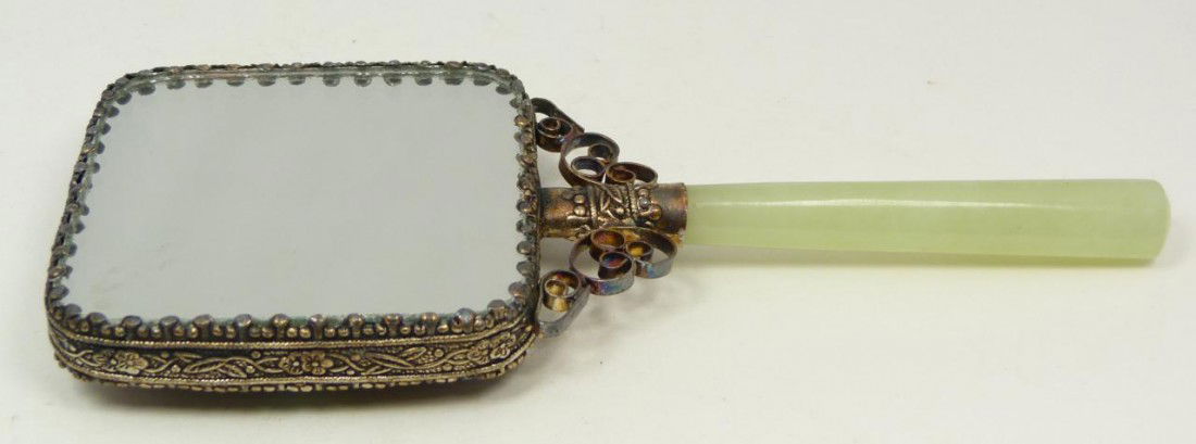 CHINESE ENAMELED SILVER & JADE HAND MIRROR: Antique Chinese silver and jade mirror. Has jade handle and plaque set to verso. Has cabochon turquoise stones set with beautiful floral enameling. 19th century. Measures 6 1/2" length x 2 3/4" width
