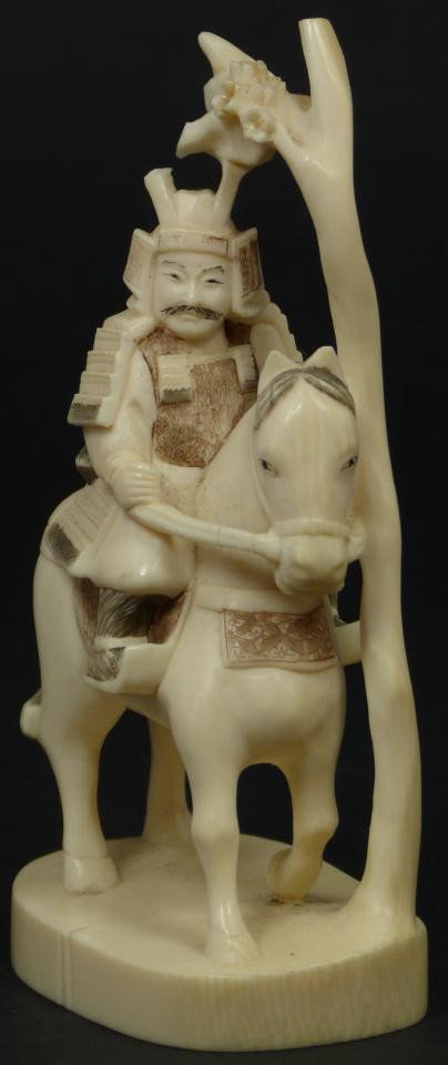 FINE JAPANESE IVORY FIGURE OF SAMURAI ON HORSEBACK: Beautiful Japanese hand carved ivory figure depicting a Samurai riding on horseback. Nicely carved and polychromed with high attention to detail. 20th century. Signed to bottom. Measures 4" height x 2