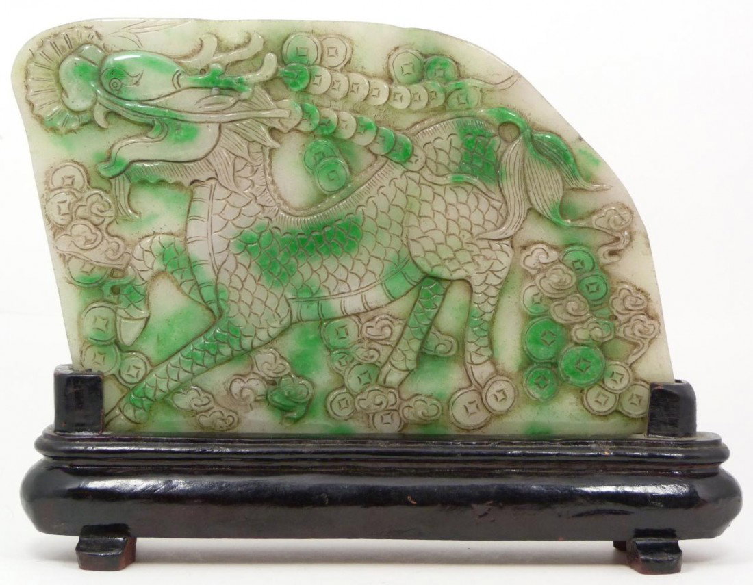 CHINESE RELIEF CARVED WHITE JADEITE QILIN PLAQUE: Stunning old Chinese hand carved jadeite plaques depicting chi lin kylin beast with numerous coins. Bringing a combination of peace and prosperity to the owner. 19th century. Includes fitted wooden di