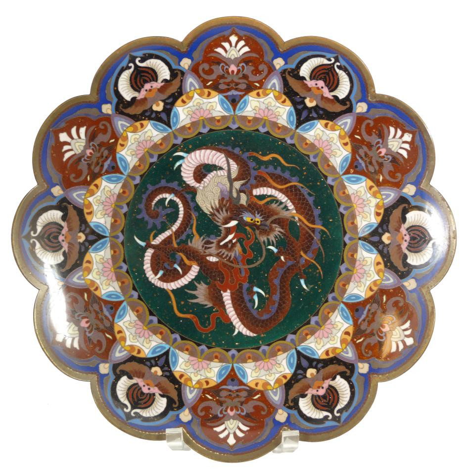 CHINESE CLOISONNE SCALLOPED DRAGON CHARGER: Antique Chinese bronze and enamel cloisonne scalloped rim dragon charger. Has a beautiful flora form shape with multicolor enamels with coppered metallic design. Border depicts flowers and bats. Late 