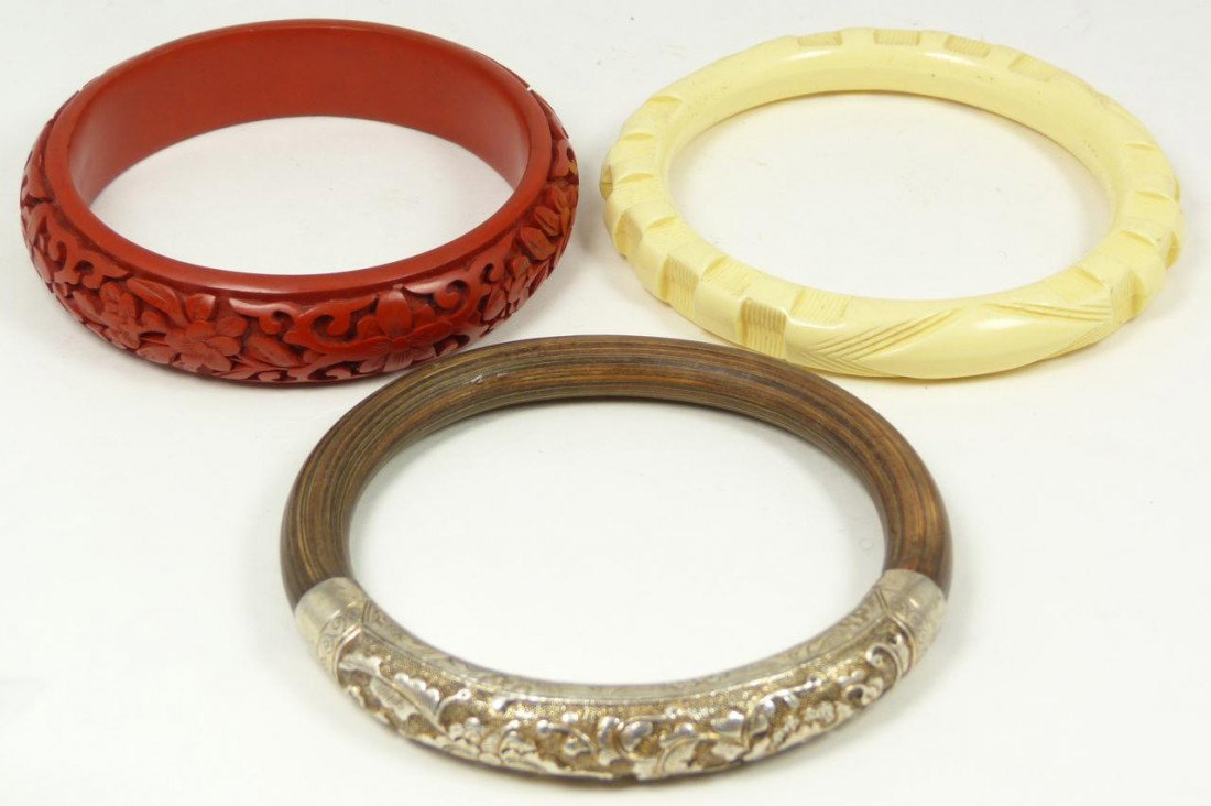 3 CHINESE CINNABAR, BONE & SILVER BANGLE: Lot of 3 Chinese bangles. Lot includes a cinnabar, ox bone, & silver bangle with bamboo. Each approx. 3 3/4" diameter (9.5cm). Total weight of 90 grams.