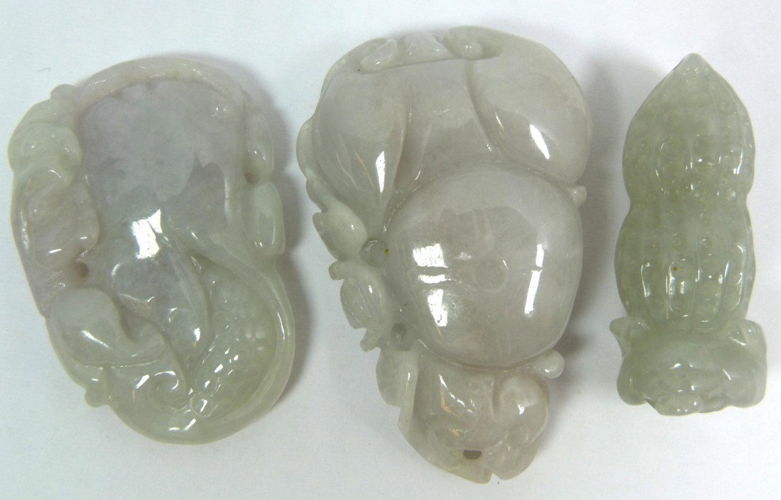 3 CHINESE CARVED ICY WHITE JADEITE PENDANTS: 3 Chinese hand carved icy white jadeite pendants including a peanut with three legged frog, lingzhi with coin an bats and pomegranate with chih lung beast. 20th century. Each measures approx. 2" lengt