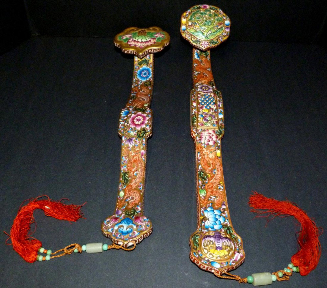 PAIR OF LATE QING DYNASTY PORCELAIN RUYI SCEPTERS: Beautiful pair of late Qing dynasty porcelain Ruyi scepters. One has a pierced screen design with trees, bats and dragons with floral designs. The other depicts dragons with fruit and lotus blossom. E