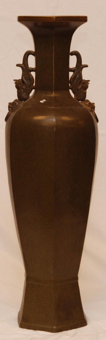 ANTIQUE CHINESE POTTERY HEXAGON FLOOR VASE: Antique Chinese brown porcelain vase. Has a hexagonal shape with two figural Phoenix handles and two figural foo dog face handles. Marked to front with archaic reign marks. 18th/19th century. Measures