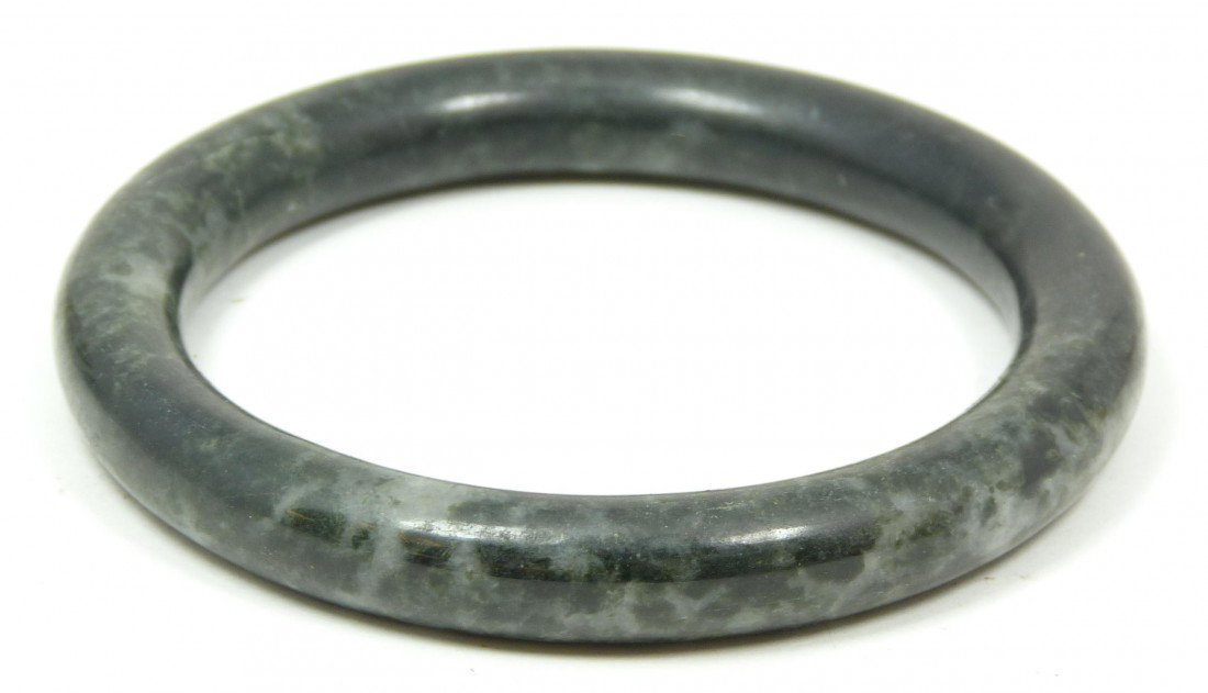 20TH CENTURY SMALL ROUND JADE BANGLE BRACELET: A small round greenish black molted jade bracelet 3” 97.62cm)