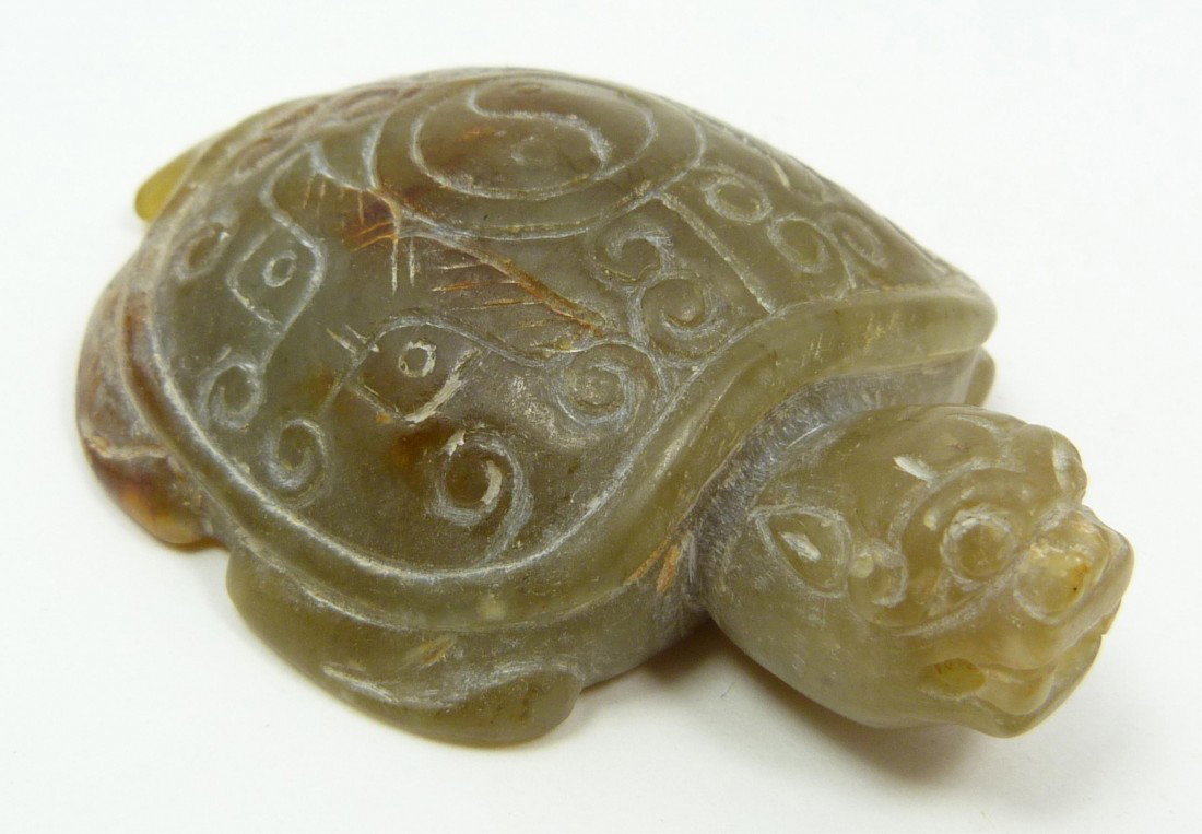 HAN DYNASTY CHINESE JADE TURTLE FIGURE: Han Dynasty hand carved Chinese jade turtle figure. Has archaic etched designs throughout. Measures 2 5/8" length x 1 3/4" width (6.6cm x 4.4cm). Total weight of 53 grams.