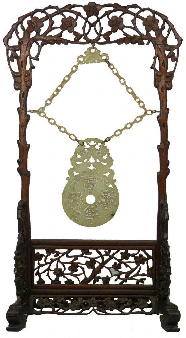 CHINESE CHIEN LUNG WOODEN SCREEN CHIME: 23" Chinese Ch'ien Lung Wood Nephrite Jade Screen Chime Hanging. A nephrite jade of a grayish white color. Chime and links hanging from a wood framed stand. The motif carved on the jade from top to bo