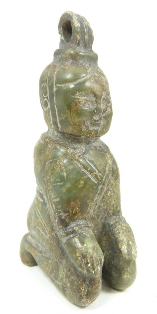 CHINESE HAN DYNASTY STYLE JADE KNEELING FIGURE: Chinese Han Dynasty Style Jade kneeling figure. Etched throughout and having deep green and russet colors. Measures 3 3/4" height x 1 1/4" width x 1 5/8" depth (9.5cm x 3.1cm x 4.1cm). Total weight of