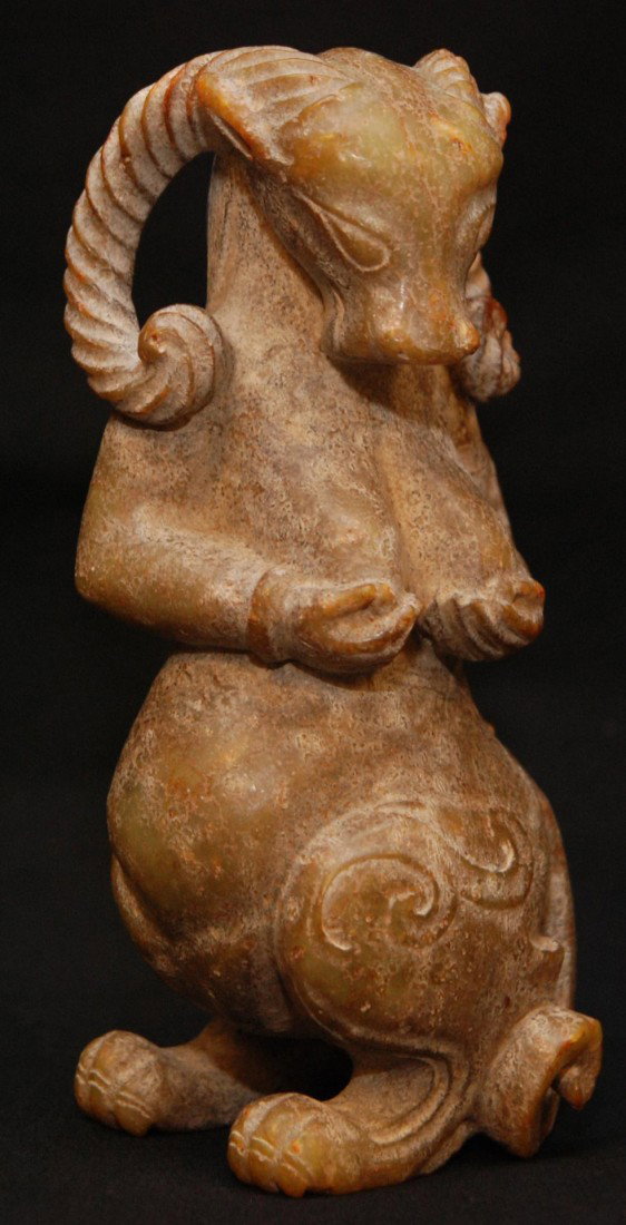 EASTERN ZHOU CHINESE JADE RAM BEAST FIGURE: Antique Chinese jade figure depicting a horned ram beast figure in a standing position. Eastern Zhou Dynasty period (770 - 221 B.C.). Measures 7 1/4" height (18.4cm). Total weight of 1303 grams. Inclu