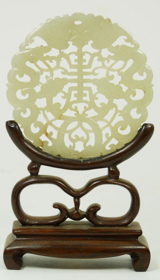 CHINESE WHITE JADE BATS RETICULATED PI DISK: Hand carved antique Chinese bi disc pendant having a reticulated bats, Lingzhi, and symbol design. Finely carved. Beautiful translucent white jade. Includes wooden fitted stand. Measures 3" diameter +