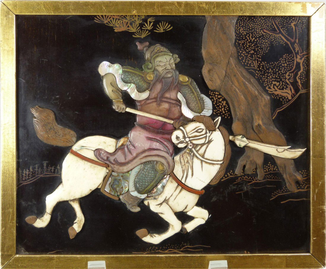 CHINESE INLAID PLAQUE OF GENERAL GUANGONG: Chinese hand crafted wall plaque depicting general Guang Gong with spear on horse back. Constructed with wood, ox bone, jade, mother of pearl and soapstone. Gilt frame. 19th/20th century. Measures 8 1