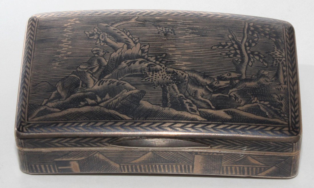 ANTIQUE RUSSIAN SILVER HUNTING HINGED BOX: Antique Russian Silver hinged box depicting hunting scenes to top and bottom. Town scenes to sides. Has a gold wash interior. Marked to interior lid and bottom and dated 1835. Slight crescent shape. M