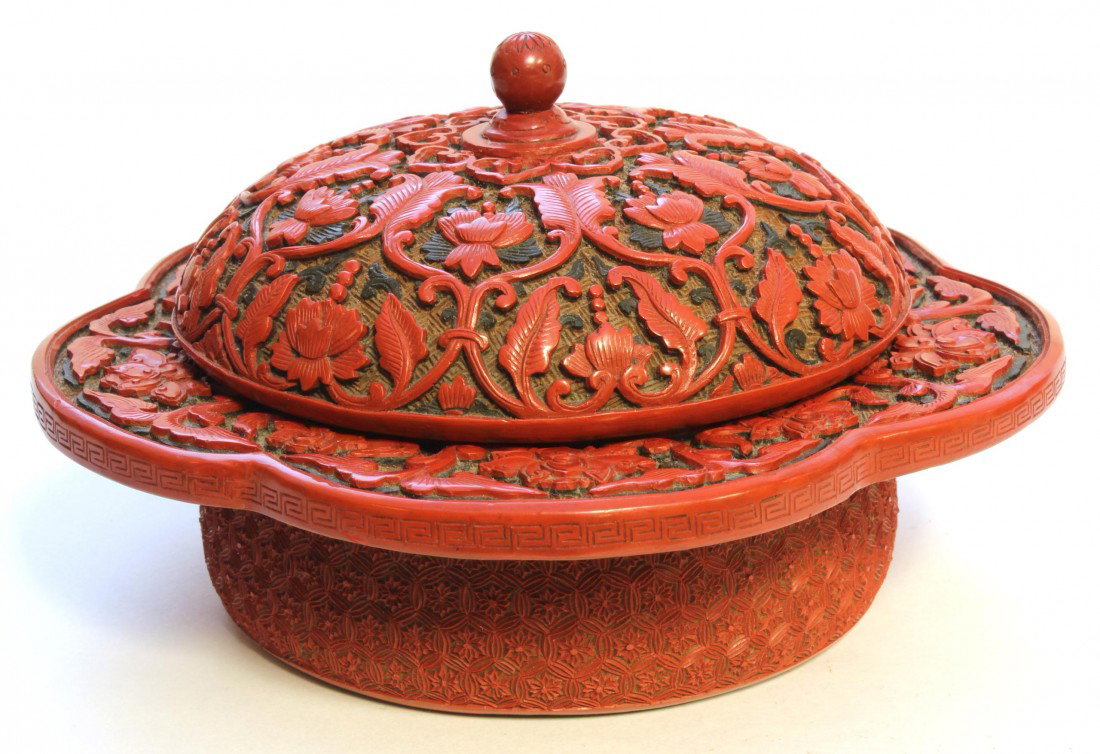 CHINESE CARVED CINABAR COVERED BOWL: Antique Chinese lacquer cinnabar covered bowl having relief carved design throughout depicting floral patterns with lingzhi mushrooms. Box has textured design throughout with textured floral matrix. B