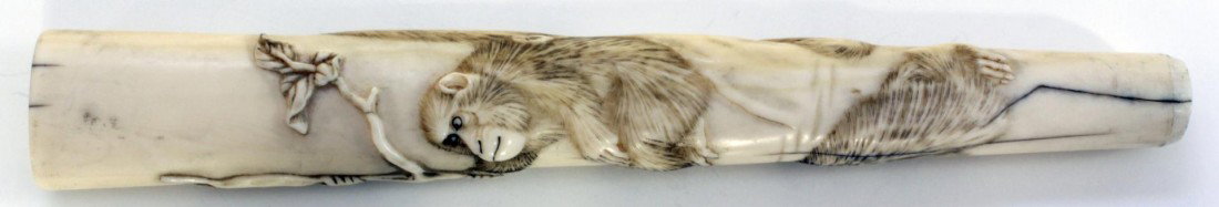 CHINESE CARVED IVORY MONKEY PARASOL HANDLE: Finely high relief carved Chinese monkey handle. Has round hollowing to bottom for attaching to a cane, wand or handle for something. 19th century. Measures 6 5/8" length x 1" width (16.8cm x 2.5cm) W