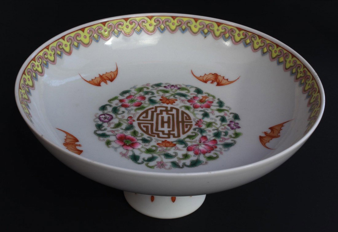 CHINESE QIANLONG PORCELAIN HIGH FOOT PLATE: Antique Chinese porcelain hand painted enameled high foot plate compote. Depicts bats with flowers and symbol to interior bowl with lingzhi border. Holds QIANLONG(1735 -1796) reign mark to bottom. Mad
