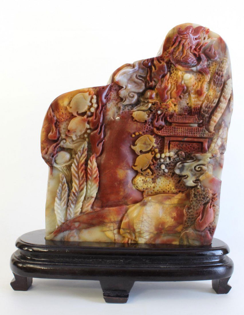 CHINESE RELIEF CARVED SHOUSHAN UNDERSEA BOULDER: Chinese hand carved Shoushan Tianhuang stone boulder. Has relief carved design depicting an underwater scene with fish, dragon fish, jelly fish, seaweed, pagoda, rock formations, and coral. 20th centu