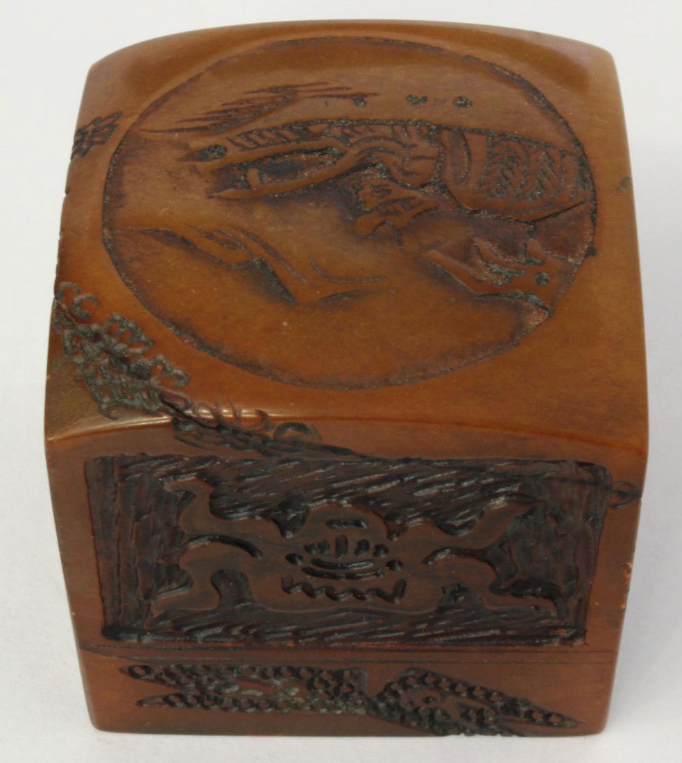 CHINESE RELIEF CARVED SHOUSHAN STONE SEAL: Chinese hand carved shoushan Tian Huang chop seal. Has square shape with relief scene to top depicting fisherman and boat. Sides have etched wealth symbol design. Relief calligraphy seal to bottom. 19