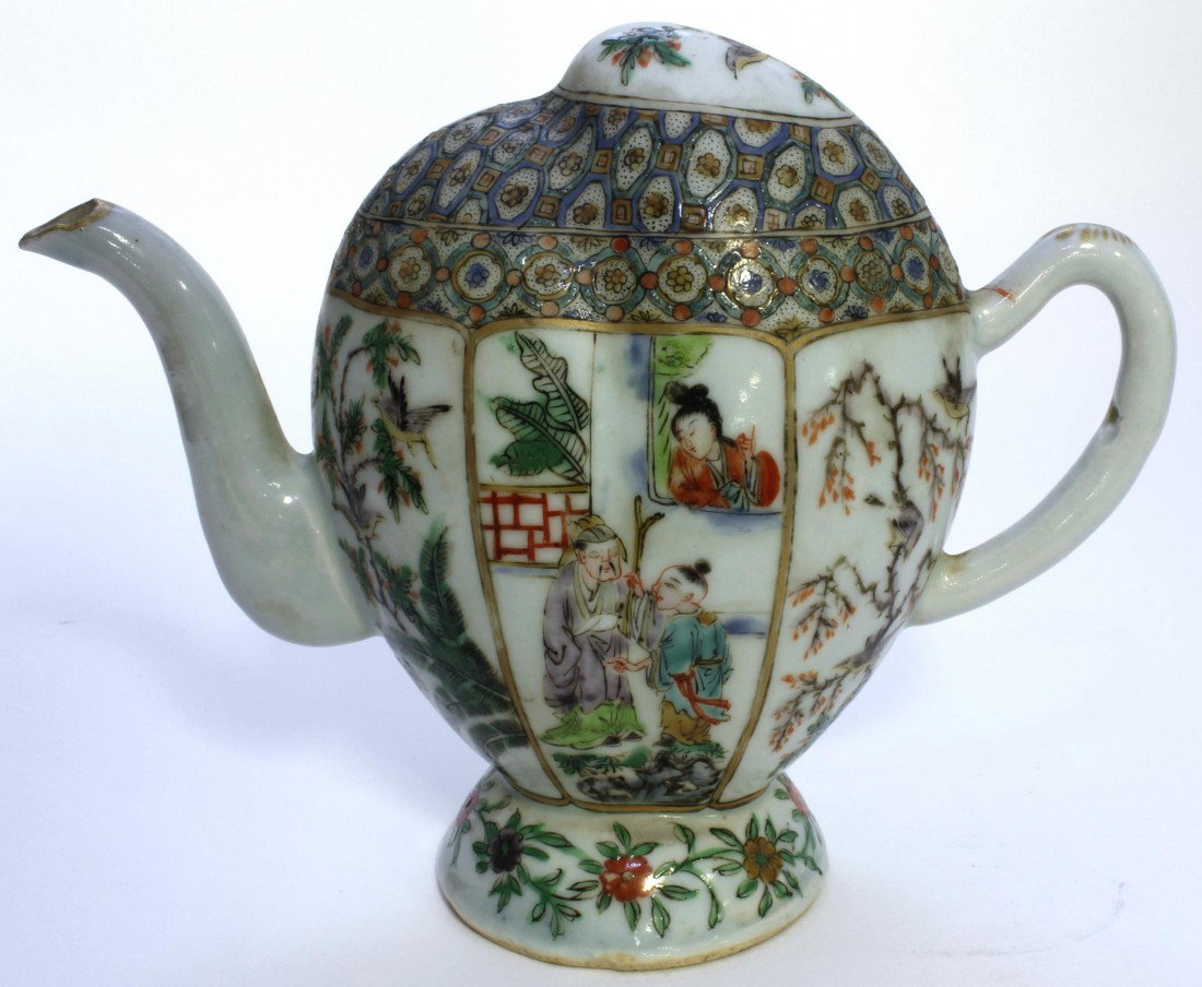 CHINESE FAMILLE VERTE PORCELAIN PUZZLE TEAPOT: Antique Chinese porcelain hand painted enameled famille verte puzzle teapot. Has courtyard scenes with figures and birds. 19th century. Measures 6" height x 7 1/2" width (15.2cm x 19.0cm). Total weigh