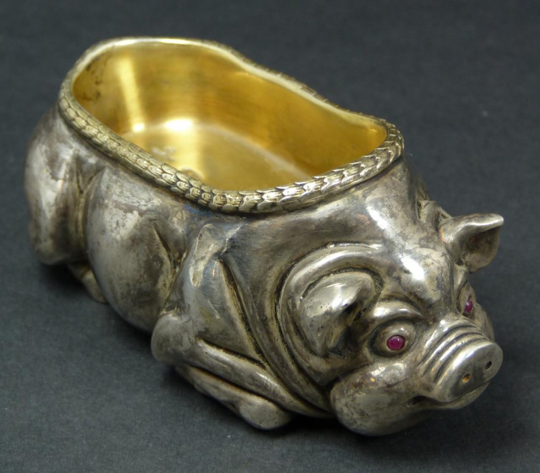 IMPERIAL RUSSIAN SILVER FIGURAL PIG SALT CELLAR: Imperial Russian silver recumbent pig figural salt cellar having cabochon cut ruby jewels set to eyes. Gold wash to bowl interior. Holds town marks and 88 silver purity marks to bottom. Holds Faberge 