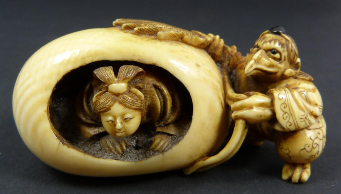 19th C JAPANESE CARVED IVORY NETSUKE TENGU & EGG: Antique hand carved Japanese ivory netsuke of bird tengu and egg with woman inside. Exquisitely carved. Has black enamel beads set to head and eyes. Signed with calligraphy to bottom. 19th century. Me