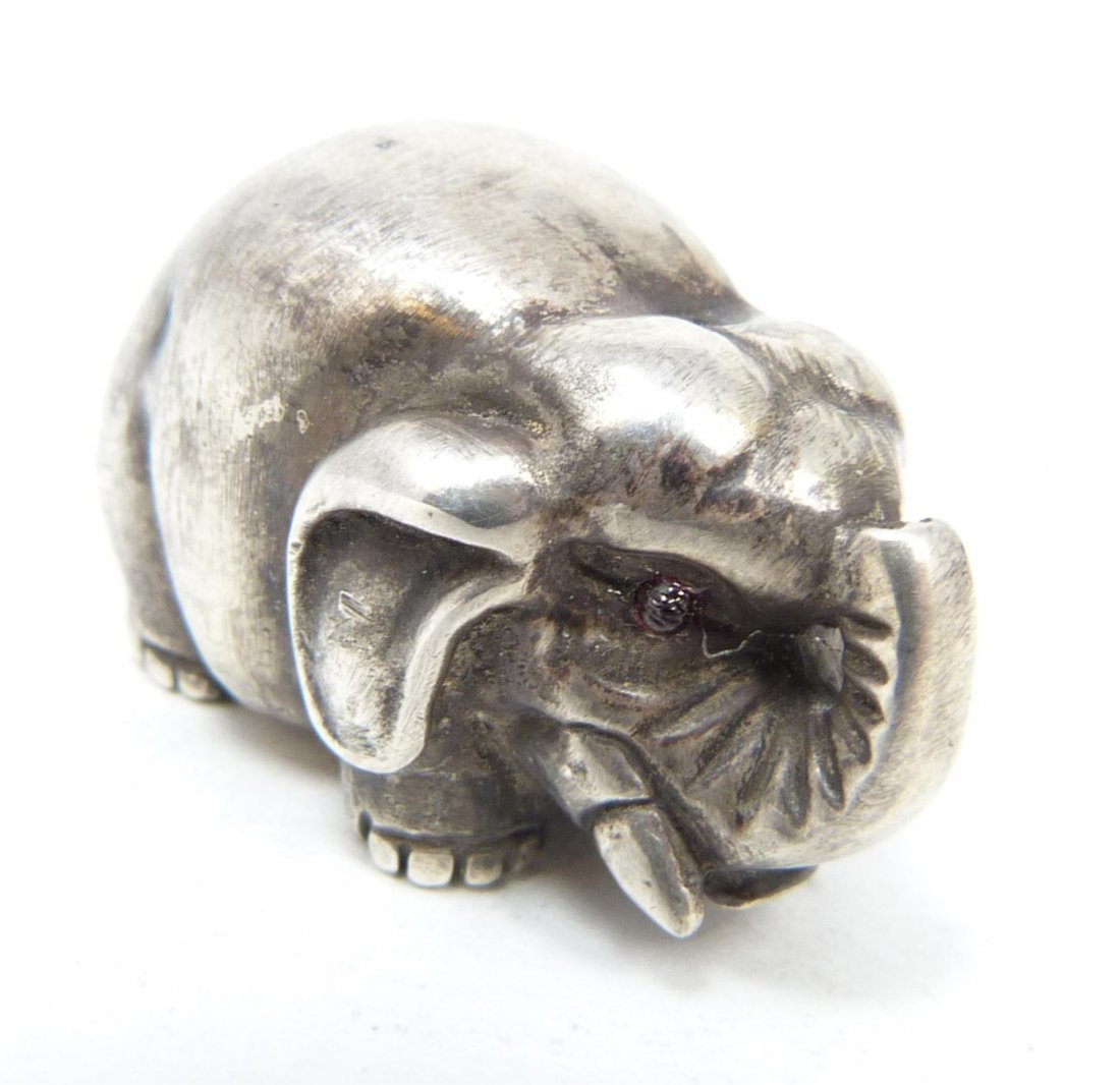 RUSSIAN SILVER ELEPHANT FIGURE RAPPAPORT: Solid Russian silver elephant figure. Finely crafted. Has cabochon cut ruby jewels set to eyes. Hold Julius Rappaport Cyrillic workmaster marks to bottom. Holds 84 silver purity marks with St. Petersb
