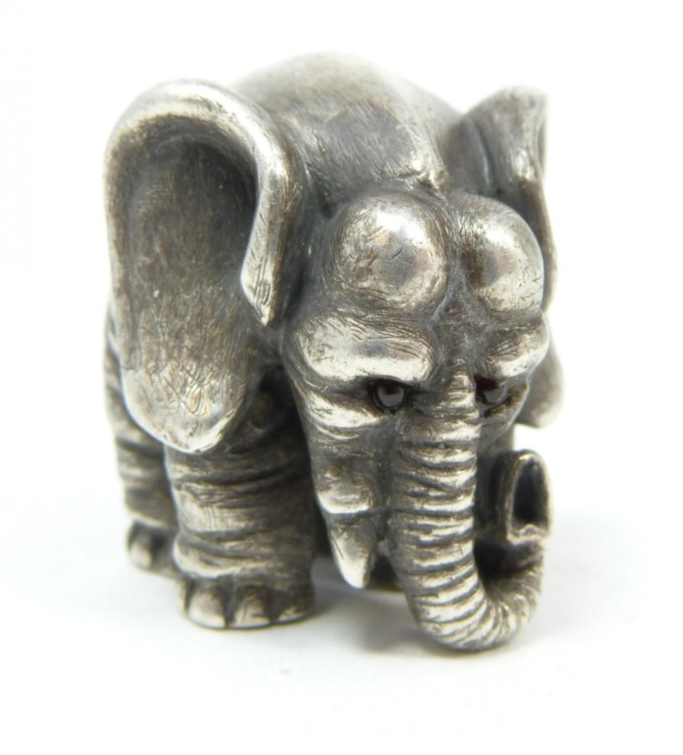RUSSIAN SILVER ELEPHANT FIGURE RAPPAPORT: Solid Russian silver elephant figure. Finely crafted. Has cabochon cut ruby jewels set to eyes. Hold Julius Rappaport Cyrillic workmaster marks to bottom. Holds 84 silver purity marks with St. Petersb
