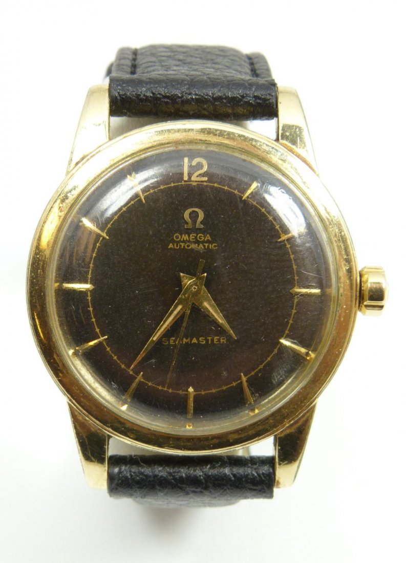 VINTAGE GENTS OMEGA SEAMASTER WRIST WATCH: Vintage men's Omega Seamaster wrist watch. Has brown face with gold notches. Has gold hour, minute and second hands. Case measures 1 3/8" diameter (3.4cm). Total weight of 44 grams.