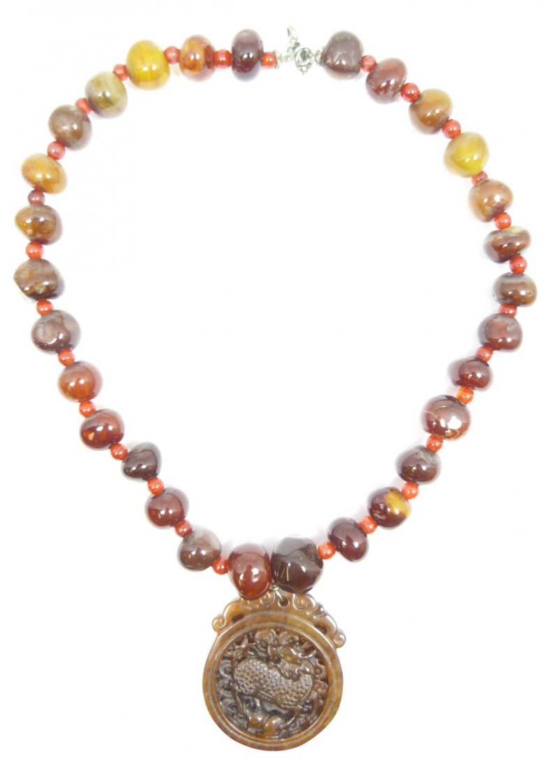 CHINESE CARVED CARNELIAN BEAD NECKLACE w PENDANT: Chinese hand carved carnelian single strand beaded necklace with relief kylin beast pendant. Measures 17" length (43.1cm). Total weight of 87 grams.