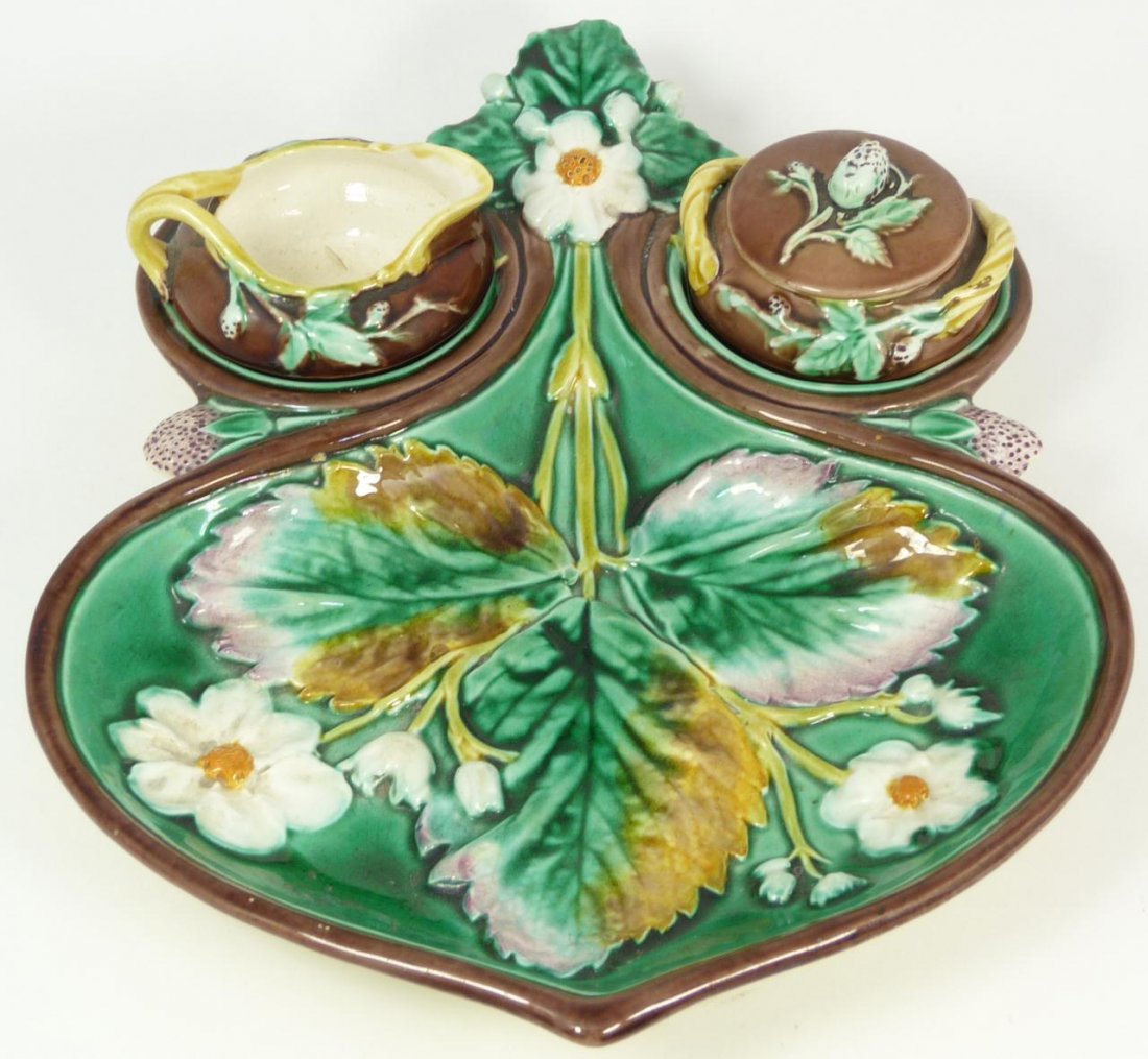 WEDGWOOD MAJOLICA STRAWBERRY DISH w SUGAR CREAMER: Antique Wedgwood English Majolica earthenware strawberry dish. Dish has fitted recesses for holding a covered sugar and creamer. Holds impressed Wedgwood mark to bottom with impressed registration mar