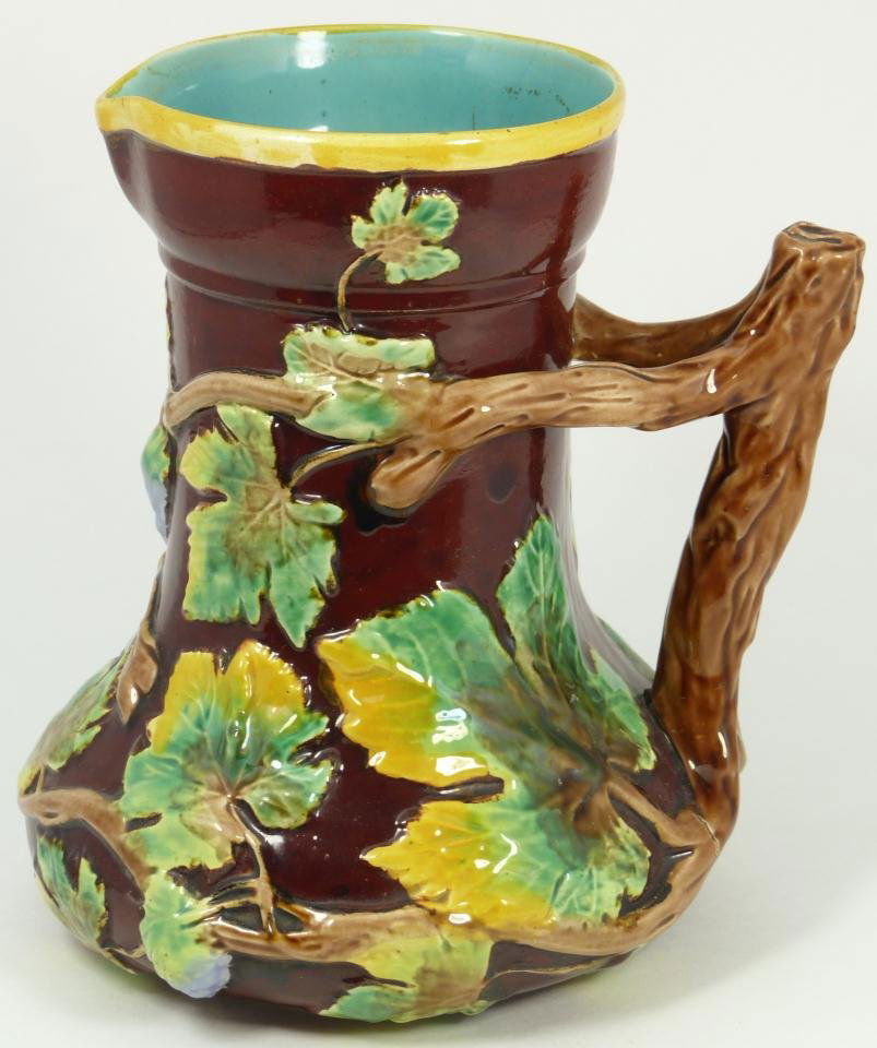 MAJOLICA POTTERY COPELAND PITCHER LEAF SNAIL: Majolica, earthenware by Copeland, in deep chocolate brown, green and yellow slip, fully expanded leaves on vining branches in relief, highlighted with snail and grape cluster, continuing with turquoi