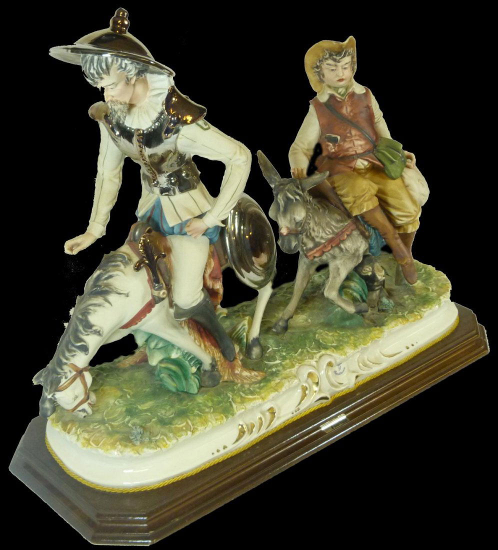 CAPODIMONTE PORCELAIN DONQUIXOTE GROUP FIGURE: Large Capodimonte La Fuente Italian porcelain group figure depicting Don Quixote and Sancho Pança riding a horse and donkey respectively. Has terra form porcelain base holding Capodimonte blue crown
