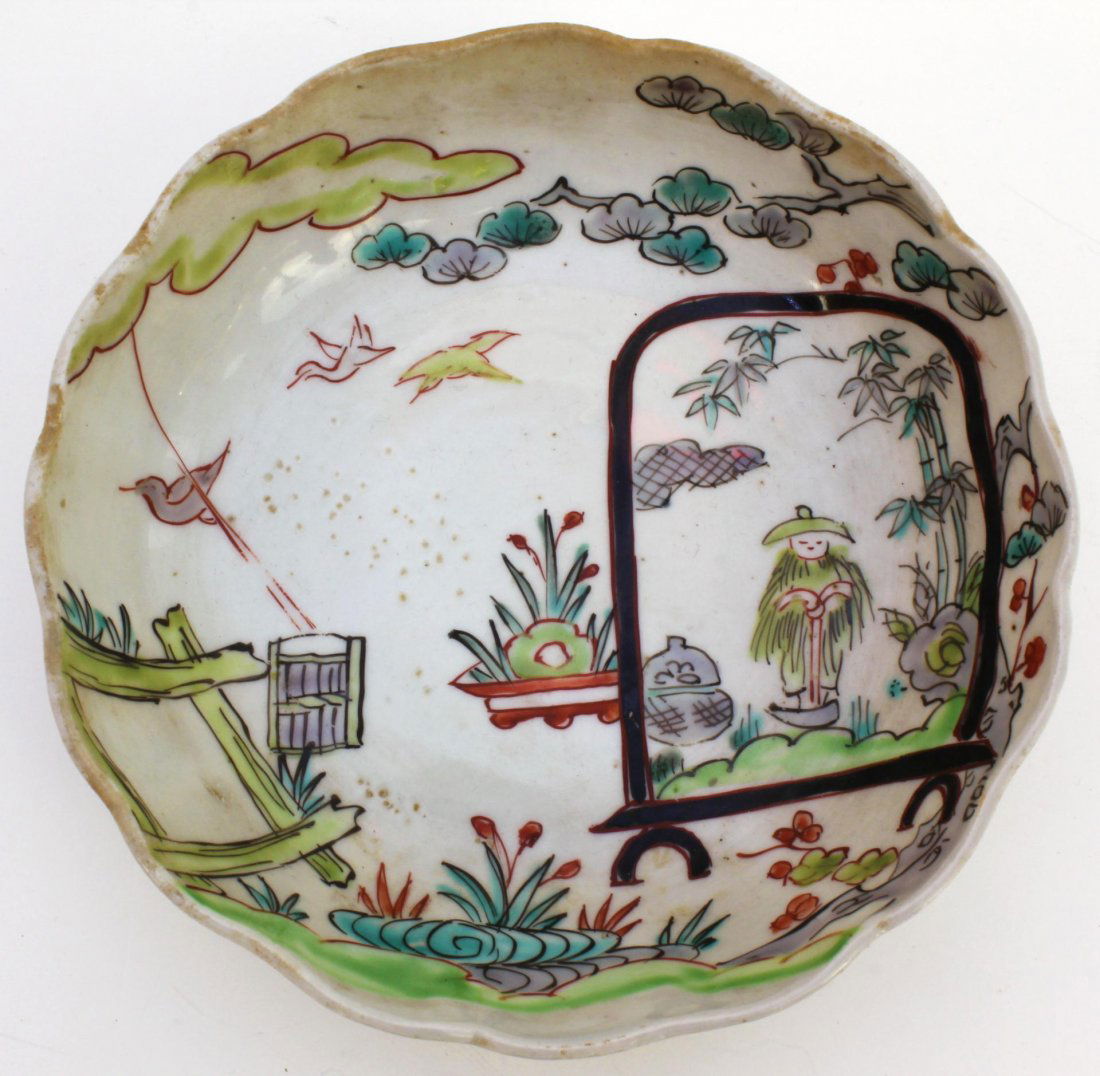 ANTIQUE JAPANESE HAND PAINTED PORCELAIN BOWL: Antique Japanese hand painted porcelain bowl. Depicts landscape scene with sage. Holds blue under glaze calligraphy to bottom. 19th century. Measures 1 3/4" height x 6" diameter (4.4cm x 15.2cm). Weig