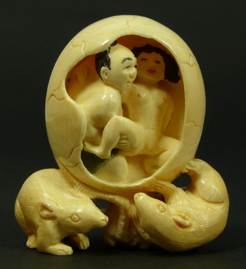 CHINESE CARVED IVORY EROTIC EGG w RATS NETSUKE: Chinese carved ivory erotic netsuke depicting a man and woman in a cracked egg supported by three rats. Signed to back. Measures 1 7/8" height (4.7cm).