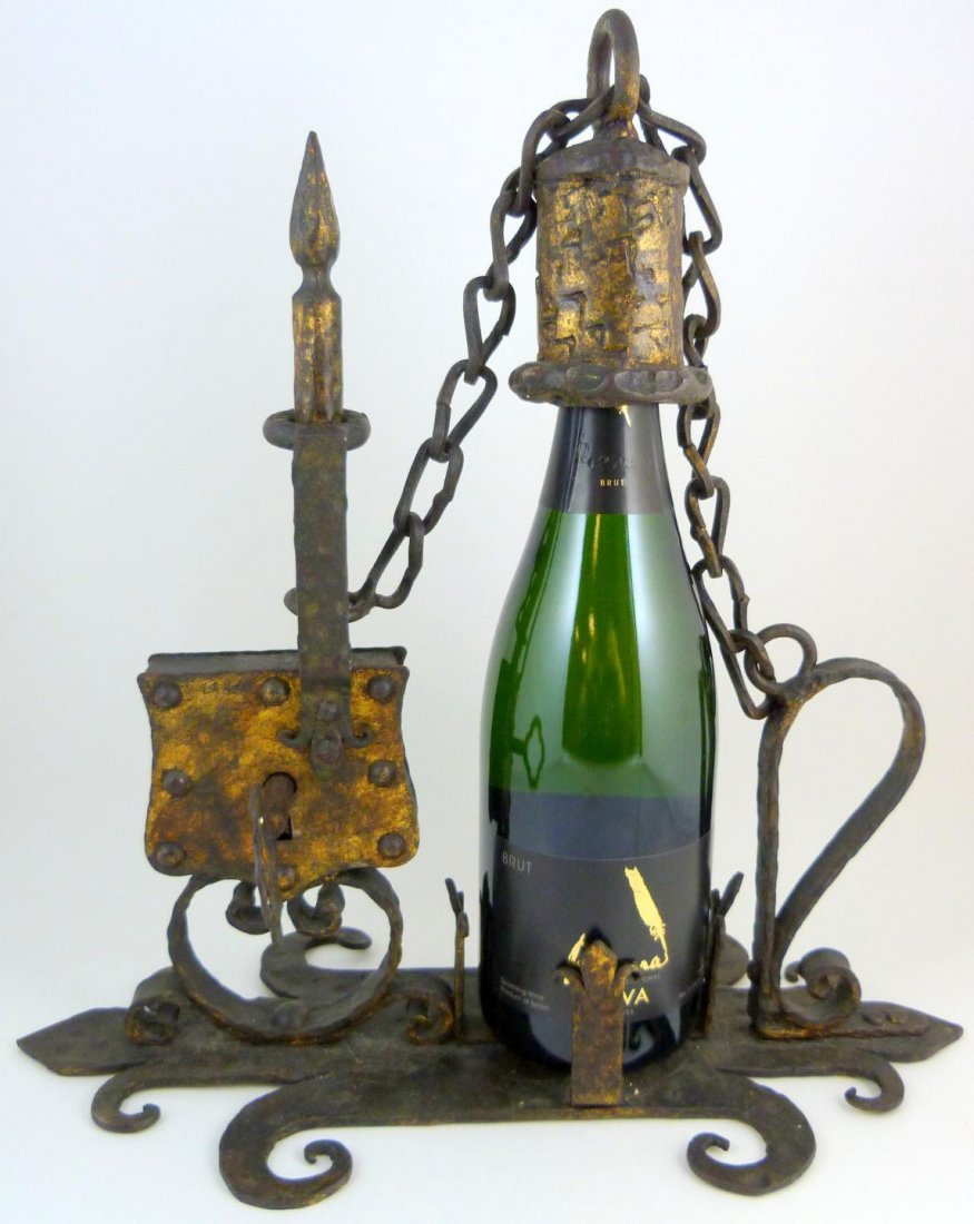 17th C SPANISH IRON BOTTLE SAFE TANTALUS: Antique Spanish bottle safe Tantalus constructed of iron. Has lock mechanism with original key. Measures 13 1/4" height x 14 7/8" length x 7 1/4" depth (18.4cm x 37.8cm x 18.4cm). Total weight of 2973