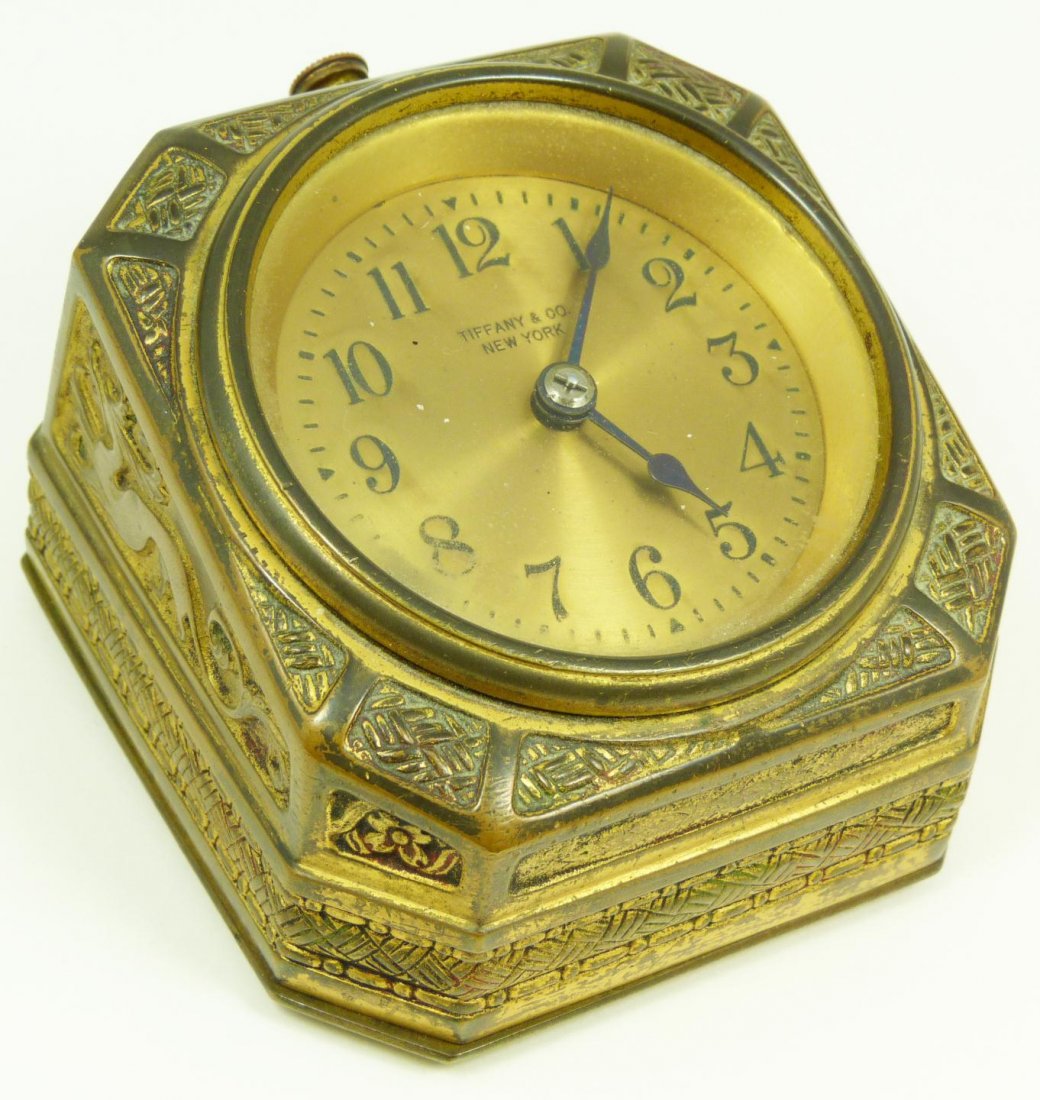 TIFFANY STUDIOS SPANISH BRONZE DESK CLOCK: Old Tiffany Studios "Spanish" bronze desk clock. Has gold tone face with black enamel numerals and notches. Tiffany & Co., New York to face. Black hour and minute hands. Impressed TIFFANY STUDIOS NEW 
