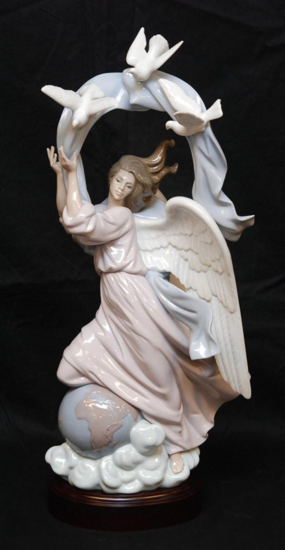 LLADRO PORCELAIN VISION OF PEACE FIGURINE 1803: Lladro Spanish porcelain figure titled "Vision of Peace". Depicts a winged angel with doves over the globe. Number 1803. Glazed finish. Sculpted by José Puche. Issued in 1995 and retired 2003. Origin