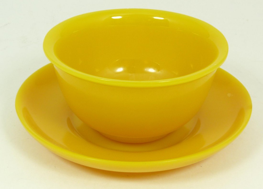 IMPERIAL YELLOW PEKING GLASS BOWL & SAUCER: Fine Qing dynasty Imperial chicken fat yellow Peking glass bowl and saucer set. Cup measures 2 1/8" height x 4 1/8" diameter (5.4cm x 10.4cm). Saucer measures 5 5/8" diameter (14.2cm). Total weight of