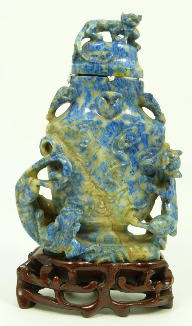 CHINESE CARVED SODALITE LIDDED CHIH LUNG URN: Chinese relief carved sodalite covered urn having raised Chih Lung dragon design to exterior. Includes fitted wooden base. 19th century. Measures 4 3/8" height (11.1cm). Total weight of 234 grams.