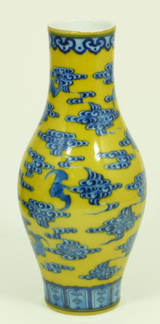CHINESE QIANLONG PERIOD BLUE & YELLOW BATS VASE: Antique Chinese blue and yellow porcelain vase depicting blue bats and clouds over mustard yellow ground. Holds six character archaic Qianlong (1736-1795) reign marks to bottom and is made of the peri