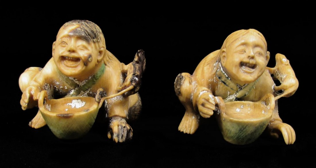 Pr CARVED IVORY NETSUKES OF KNEELING MEN w BASKETS: Pair of Japanese hand carved ivory netsuke. Each figure is polychromed and depicts a kneeling man with a pot of soup and escaping rat. Each measures approx. 1 3/8" height (3.5cm). Total weight of 50 g