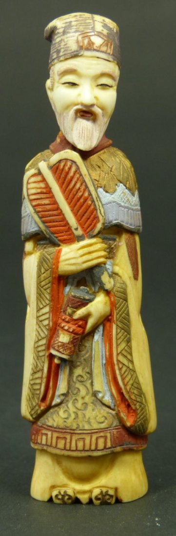 CHINESE CARVED IVORY FIGURAL SNUFF BOTTLE: Old Chinese hand carved ivory figural snuff bottle depicting a wiseman with fan and scroll. Finely carved and polychromed throughout. Measures 3 1/4" height (8.2cm). Total weight of 24 grams.
