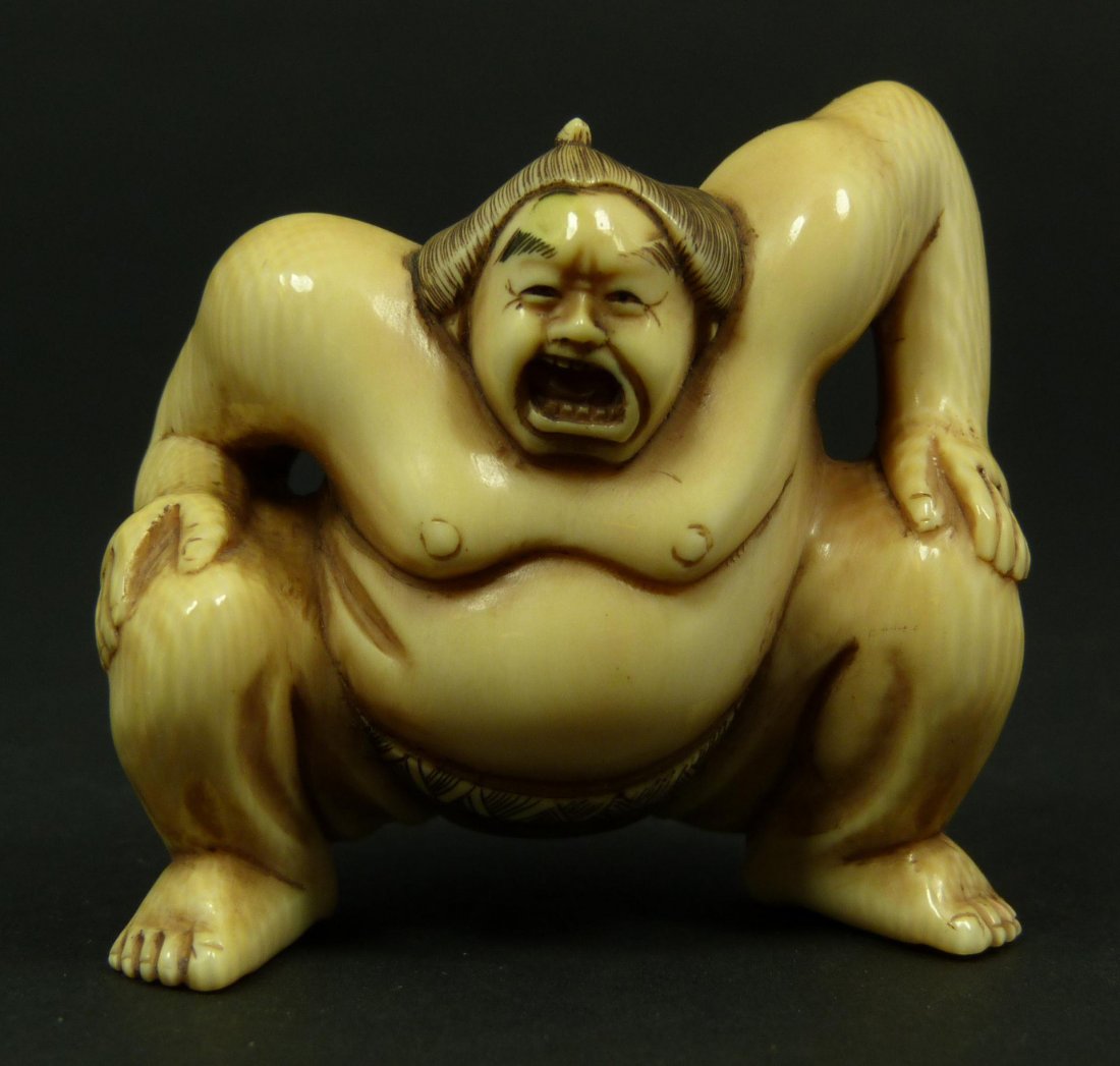 JAPANESE CARVED IVORY NETSUKE SUMO WRESTLER FIGURE: Old Japanese hand carved ivory netsuke figure depicting rikishi in squatting position. Signed Songshan to bottom. 19th/20th century. Measures 1 7/8" height (4.7cm). Total weight of 45 grams.