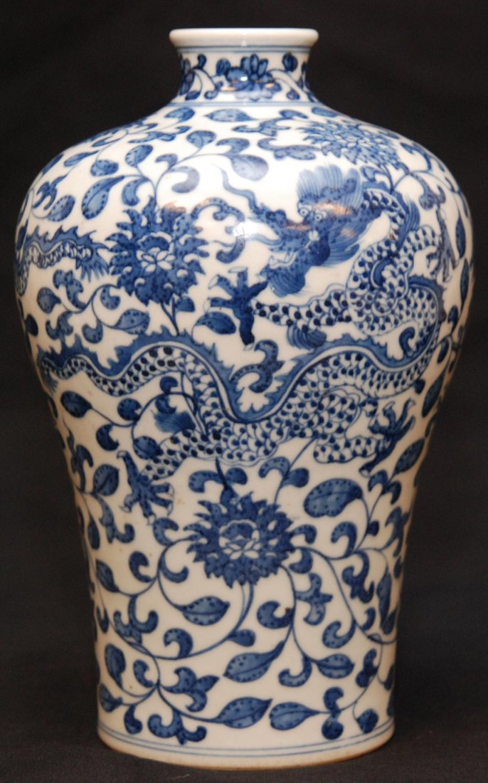 CHINESE QIANLONG PORCELAIN DRAGONS VASE: Chinese Qing Dynasty Qianlong hand painted blue and white porcelain mei ping vase having dragon and lotus blossom design throughout. Holds Qianlong (1736-1795) six character archaic reign mark to bott