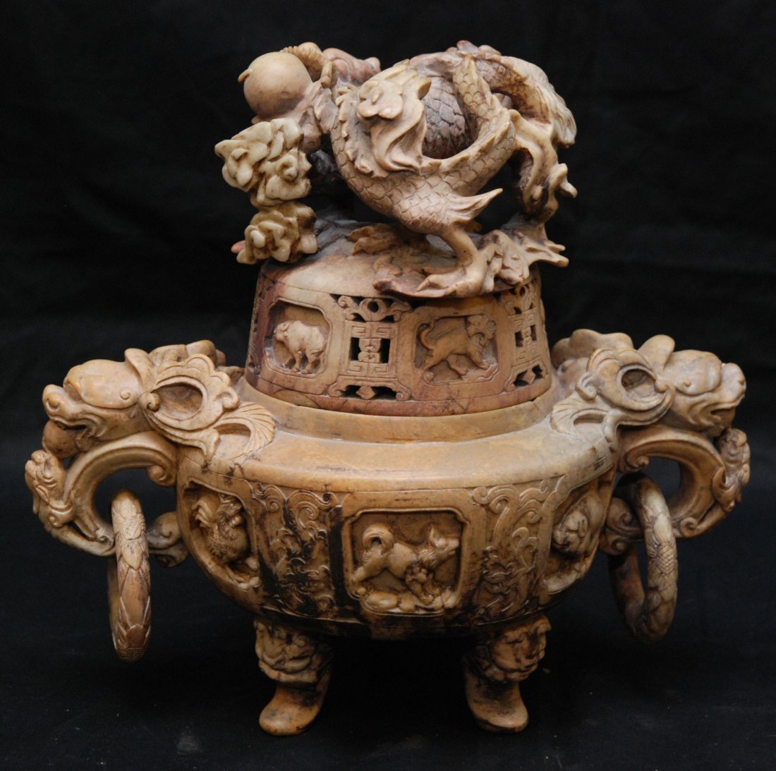 CHINESE CARVED SOAPSTONE T'UNG CHI CENSOR: Antique Chinese Qing dynasty relief carved soapstone tripod zodiac censor. Very intricately carved throughout do depict dragon with jewel to cover with snake, rat, ox, tiger and rabbit to sides. Body 