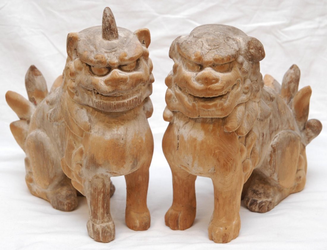 PAIR OF 17th C JAPANESE CARVED WOODEN SISHI DOGS: Pair of antique Edo Period Japanese carved wooden shishi dogs for guarding Shinto shrine. Each depicted in seated position with relief carved mouths. Each measures approx. 12 1/2" height (31.7cm). Tot